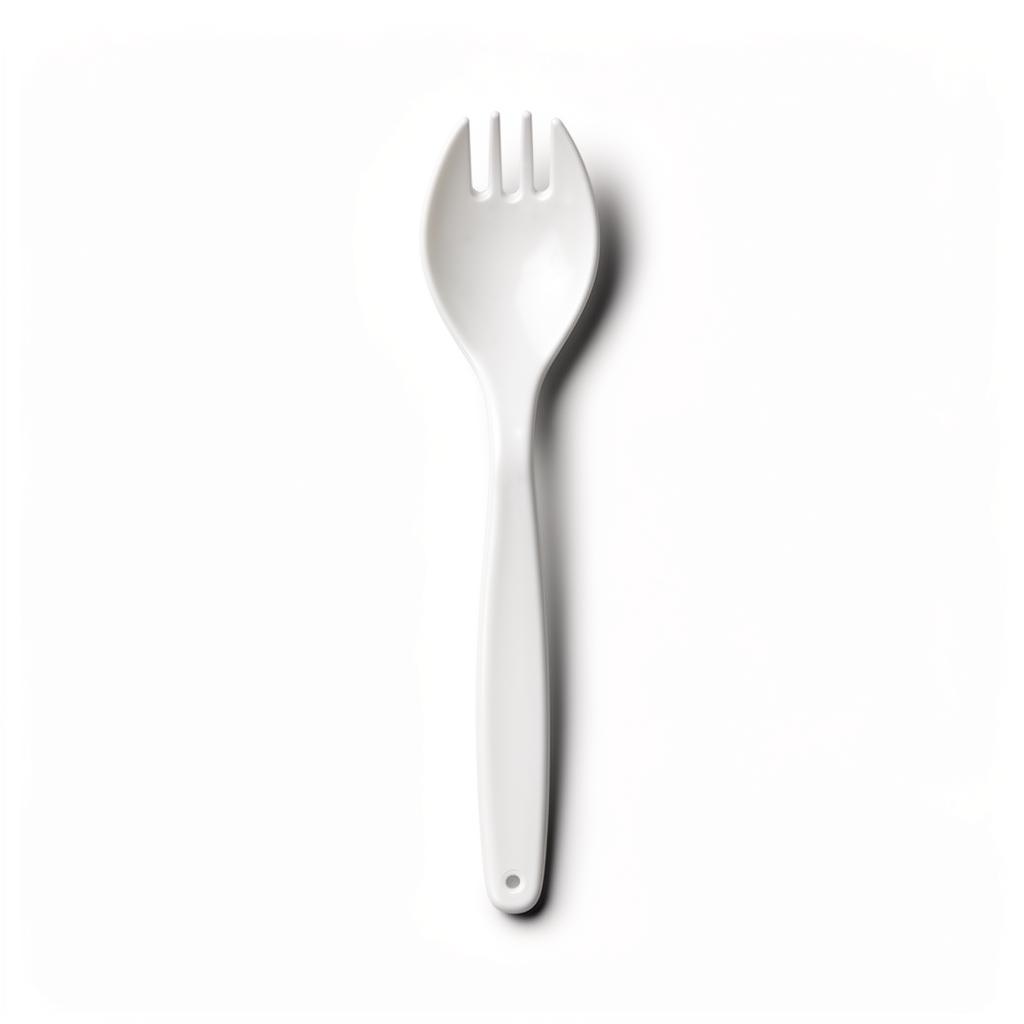 A single white plastic spork